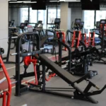 Gym member utilizing exclusive Max Pump machines in Amman to safely improve performance and strength.